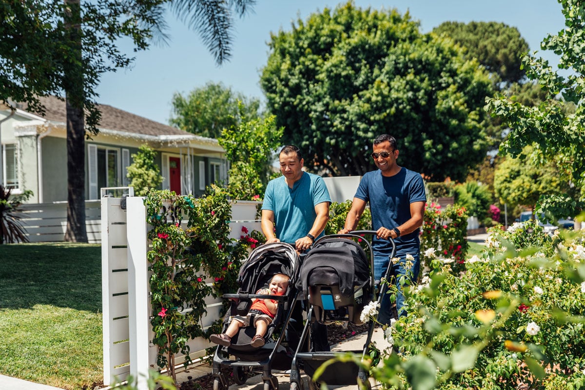 Dads push babies in strollers