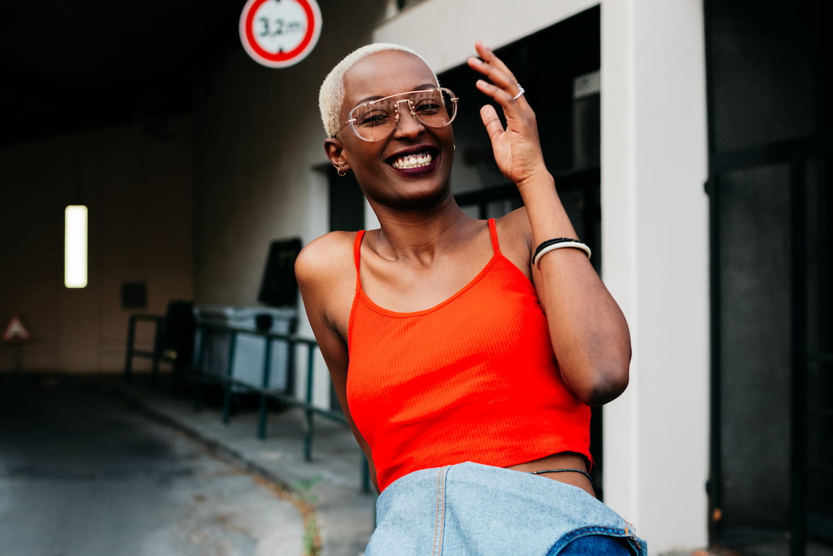 Cool and stylish African Woman with shaved blond hair laughing