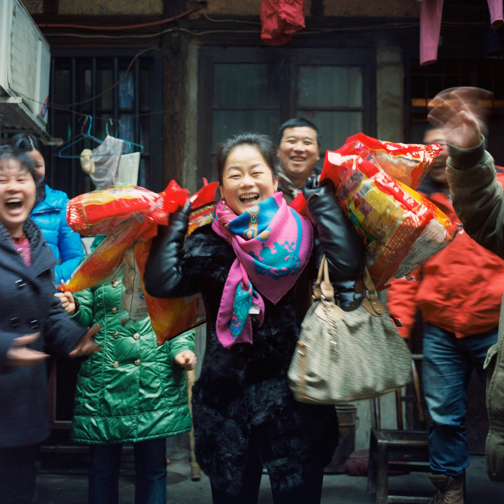 Women Dance Happily With Big Gift Bags