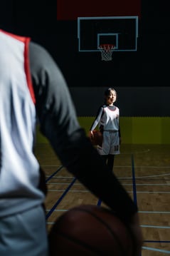 Portrait Of Female Basketball Player In Gym
Female school girl in basketball uniform standing in gym