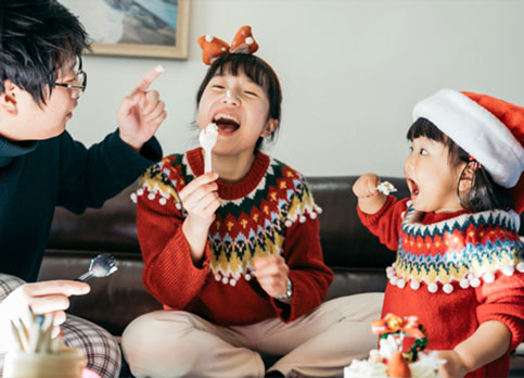 Family celebrates winter with Christmas sweaters and treats