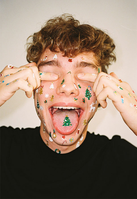 User-Generated Content Man With Christmas Stickers Covering Eyes